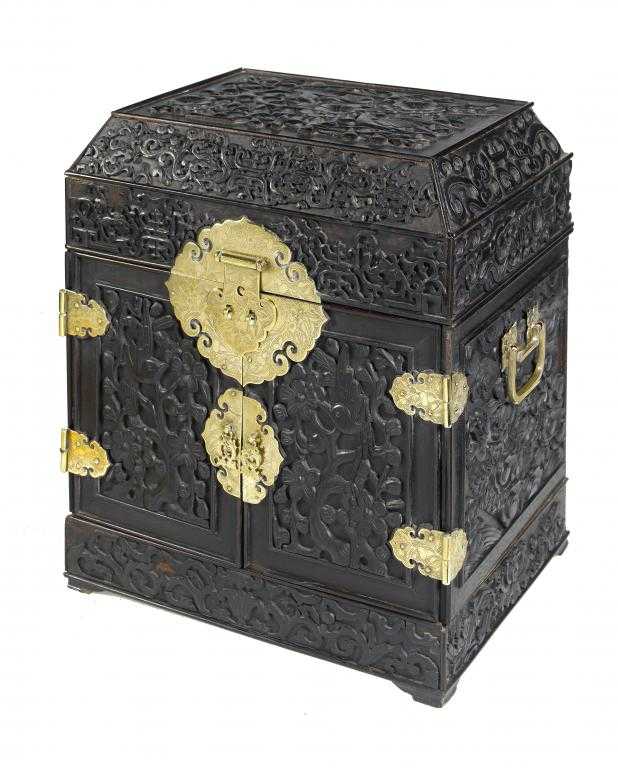 Appraisal: A CHINESE CARVED HARDWOOD TABLE CABINET with engraved brass mounts