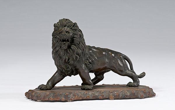 Appraisal: JAPANESE BRONZE LION th century depicted striding forward with mouth