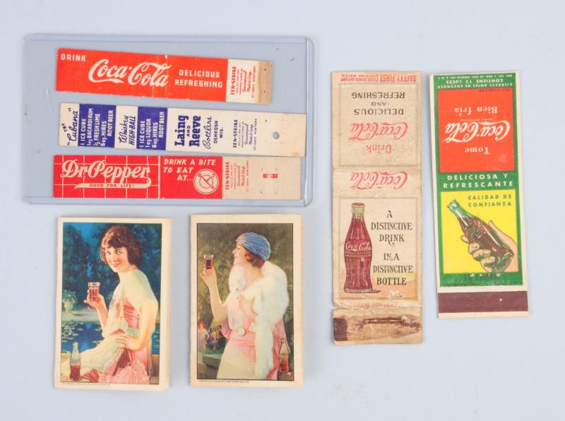 Appraisal: Lot Of Small Soda Advertising Items This lot includes two