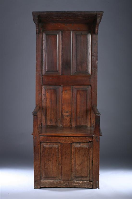 Appraisal: FRENCH PROVINCIAL WALNUT CANOPY-TOPPED CHOIR STALL th century Molded-edge canted