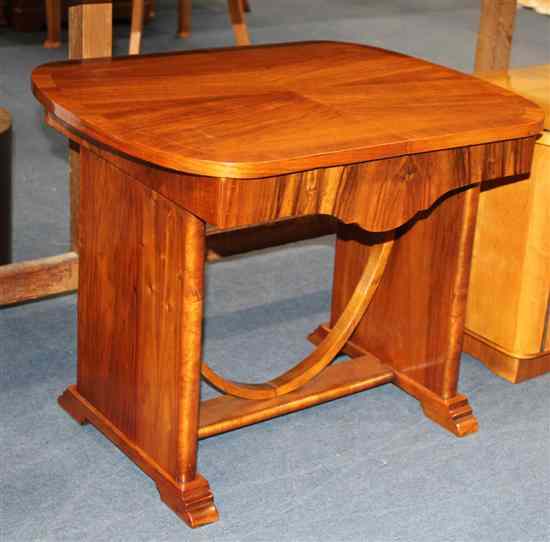 Appraisal: An Art Deco walnut occasional table on standard end supports