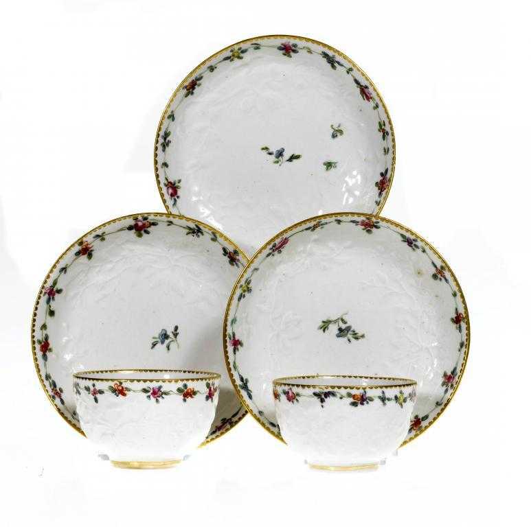 Appraisal: A PAIR OF CHELSEA-DERBY MOULDED TEA BOWLS AND SAUCERS AND