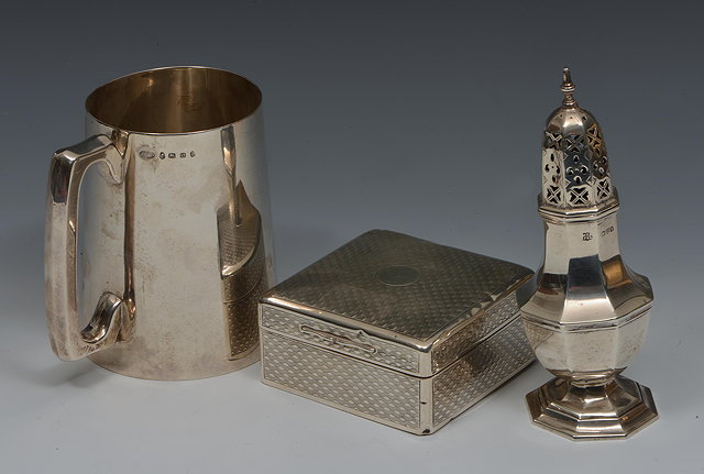 Appraisal: A VICTORIAN SILVER TANKARD with tapering body and squared loop