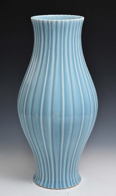 Appraisal: A CHINESE PALE BLUE BALUSTER VASE of reeded form Qianlong