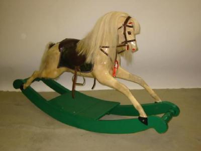 Appraisal: A rocking horse carved and painted wood construction with nylon