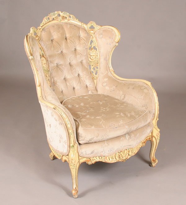 Appraisal: French Provincial style wing chair upholstered surface painted and carved