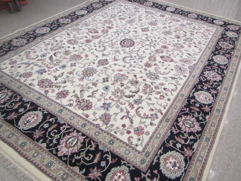 Appraisal: HAND KNOTTED ORIENTAL CARPET Indo-Persian Isfahan floral design on cream