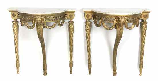 Appraisal: A Pair of Neoclassical Giltwood Console Tables each having a