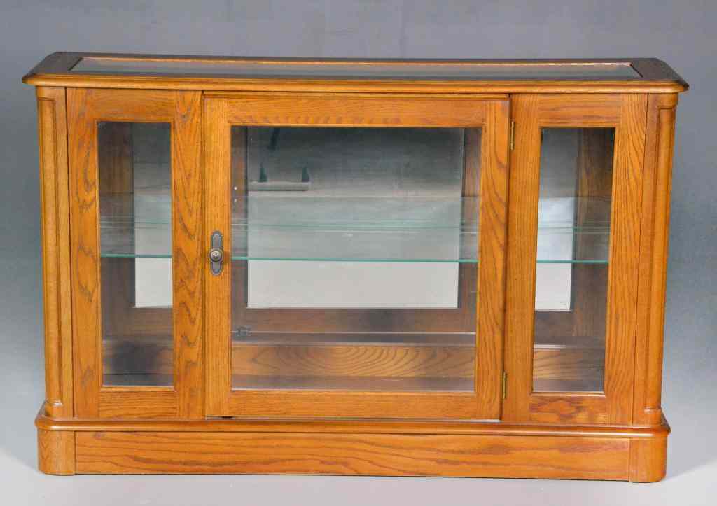 Appraisal: Hall Oak Curio CabinetOak with curved molded edge having bevelled