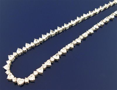 Appraisal: An impressive diamond necklace set with forty nine graduated heart