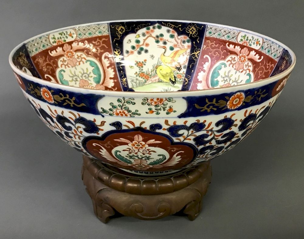 Appraisal: Colorful Imari Punch Bowl on Carved Wood Stand Large colorful