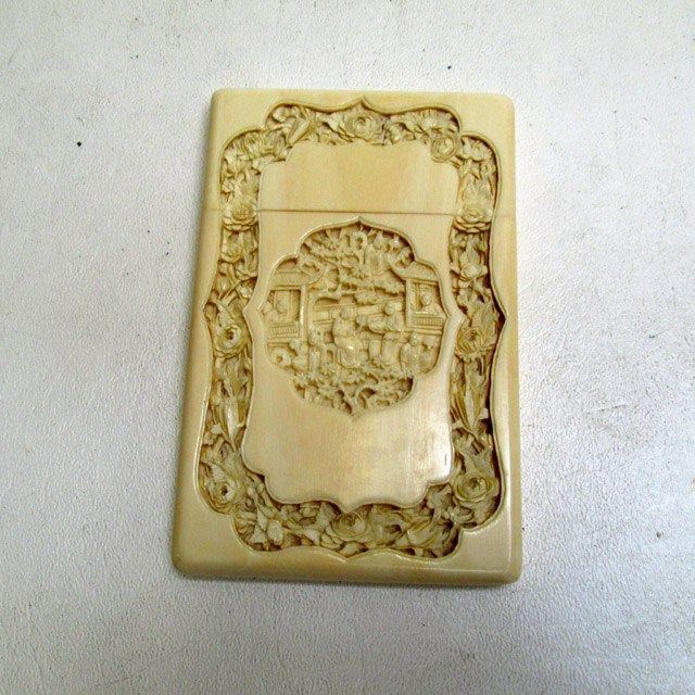 Appraisal: CHINESE CARVED IVORY CARD CASE with intricately carved reserves on