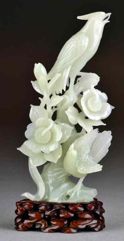 Appraisal: Chinese Qing Celedon Jade Bird CarvingVery intricately carved to depict