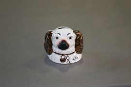 Appraisal: Two Staffordshire spaniel jugs together with a Staffordshire spaniel head