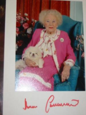 Appraisal: Three signed coloured photographs of Dame Barbara Cartland and two