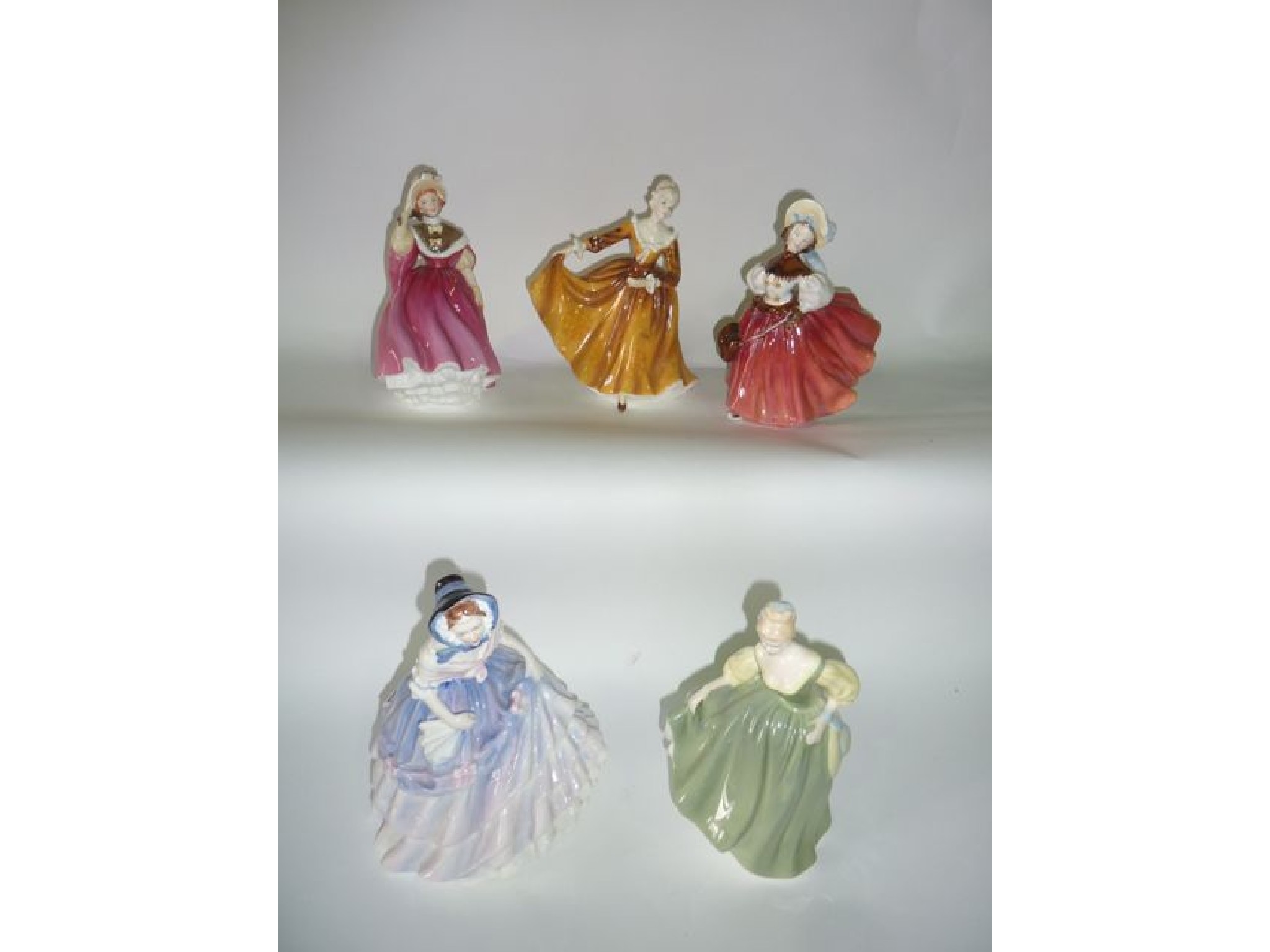 Appraisal: A collection of five Royal Doulton figures - The Skater