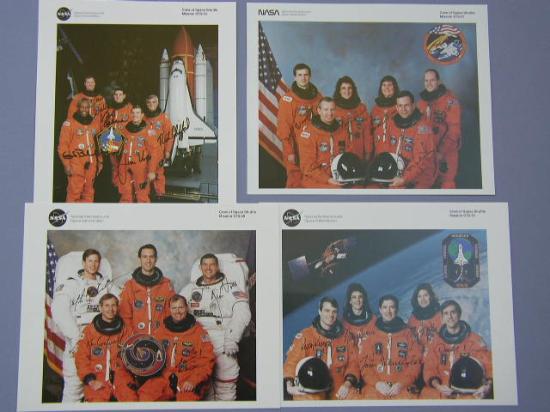 Appraisal: Shuttle Crew Portraits Four completely signed official NASA color crew