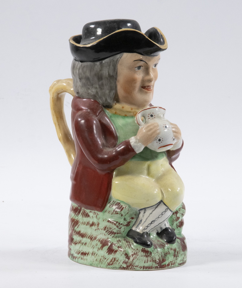 Appraisal: ENGLISH STAFFORDSHIRE TOBY JUG Early th c Staffordshire Figural lidded