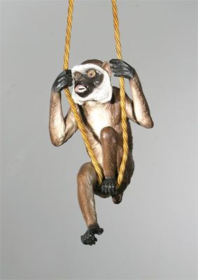 Appraisal: A German porcelain model of a monkey with glass eyes