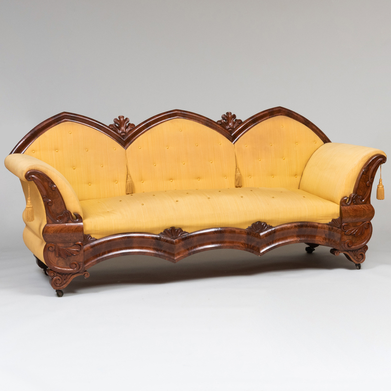 Appraisal: Gothic Revival Carved Mahogany and Upholstered Sofa x ft x