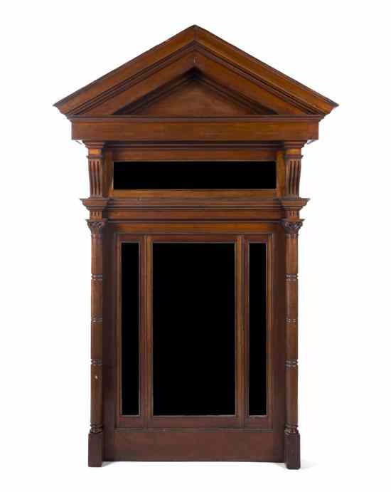 Appraisal: A Neoclassical Mahogany Hall Mirror having a peaked pediment and