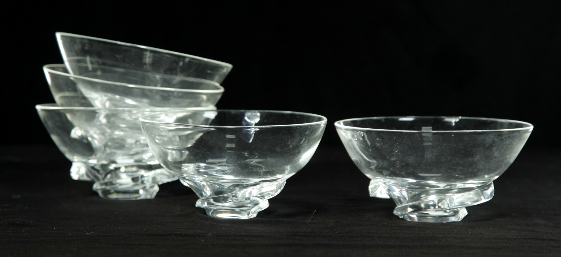 Appraisal: FIVE SIGNED STEUBEN CLEAR GLASS FOOTED BOWLS American nd half-