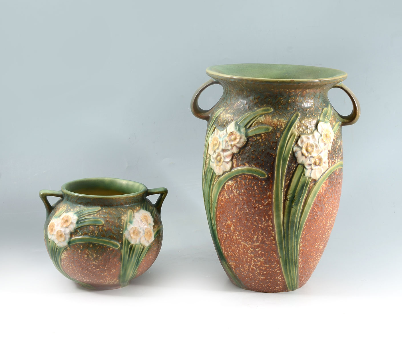 Appraisal: PIECE JONQUIL ROSEVILLE VASES Comprising tall vase and squat vase