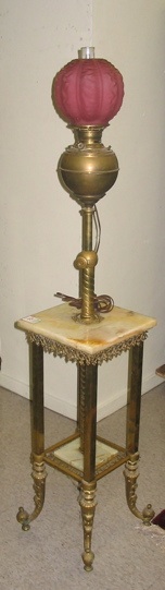 Appraisal: A VICTORIAN BRASS KEROSENE FLOOR LAMP American c The brass