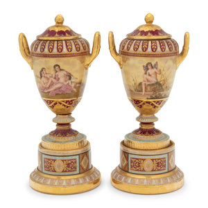 Appraisal: A Pair of Vienna Porcelain Urns th Century each bearing