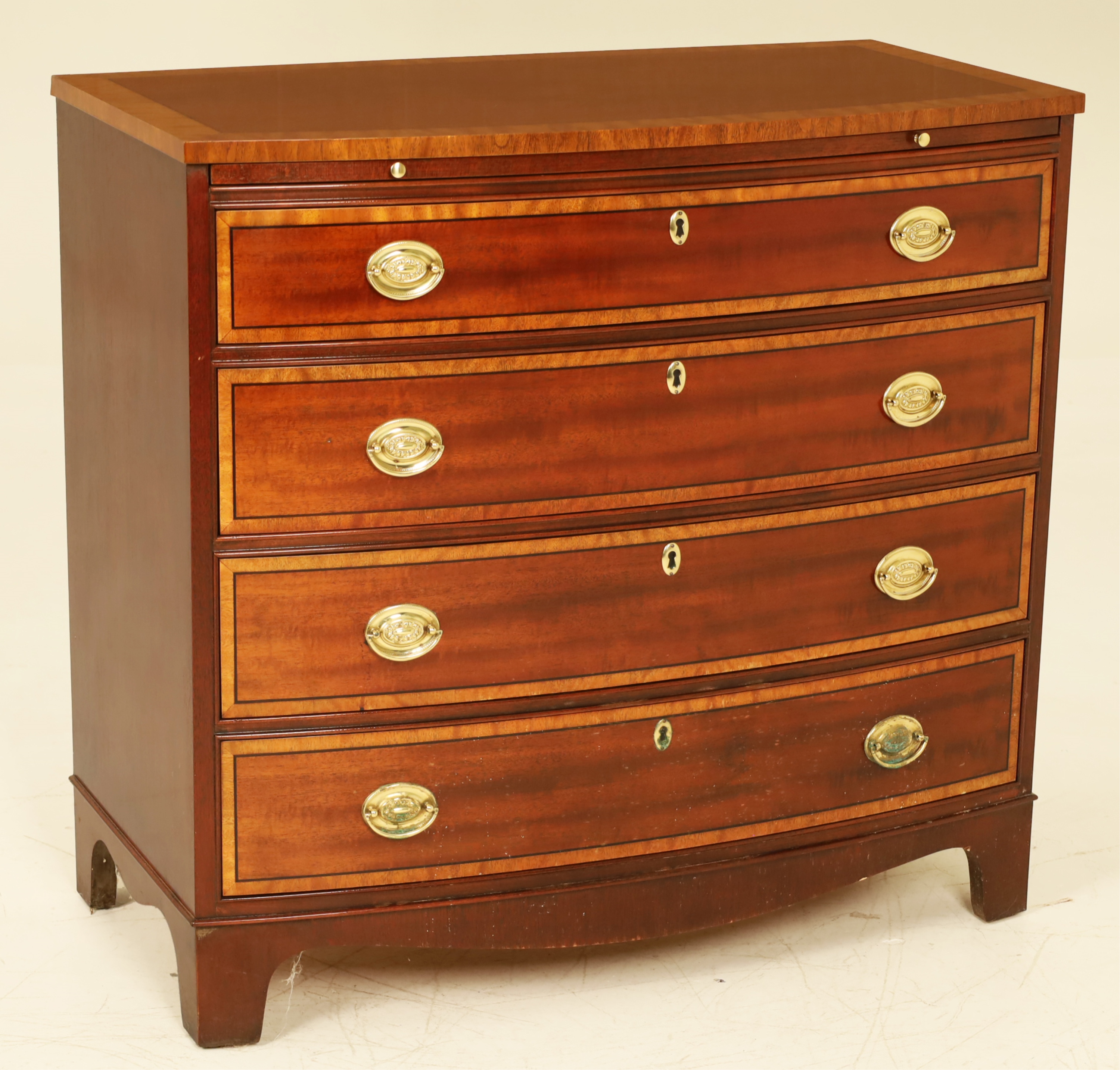 Appraisal: BAKER BOW FRONT CHEST Inlaid Hepplewhite style mahogany satinwood banded