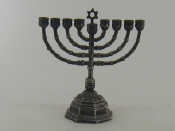 Appraisal: A cast silver-plated menorah on octagonal pedestal base cm high