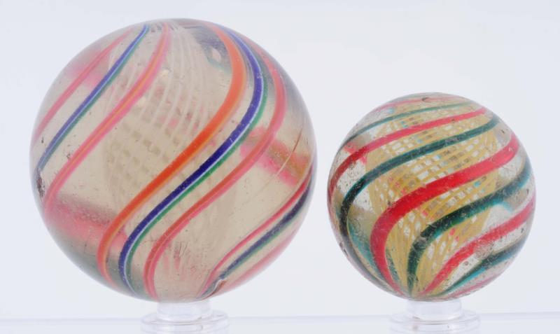 Appraisal: Lot Of Large Swirl Marbles The smaller is a yellow