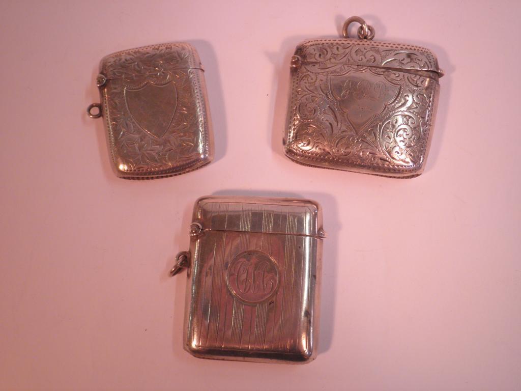 Appraisal: Three Victorian silver vesta cases one engraved with leaves and