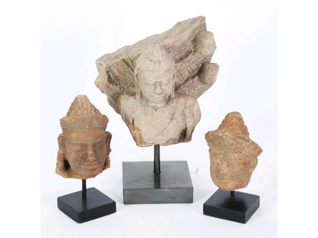 Appraisal: AN AGED FAR EAST ASIAN CARVED SANDSTONE FRAGMENT OF BUDDHA