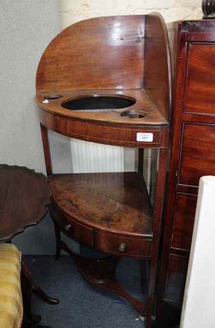 Appraisal: A GEORGE III BOWFRONTED MAHOGANY CORNER WASH STAND the upper