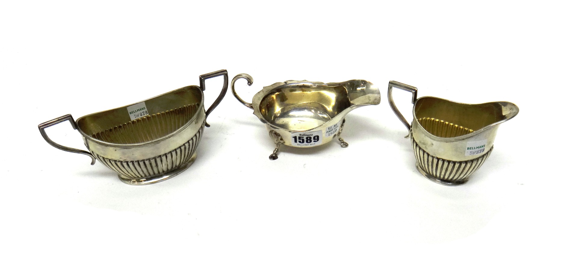 Appraisal: A silver sauceboat with a shaped rim raised on three