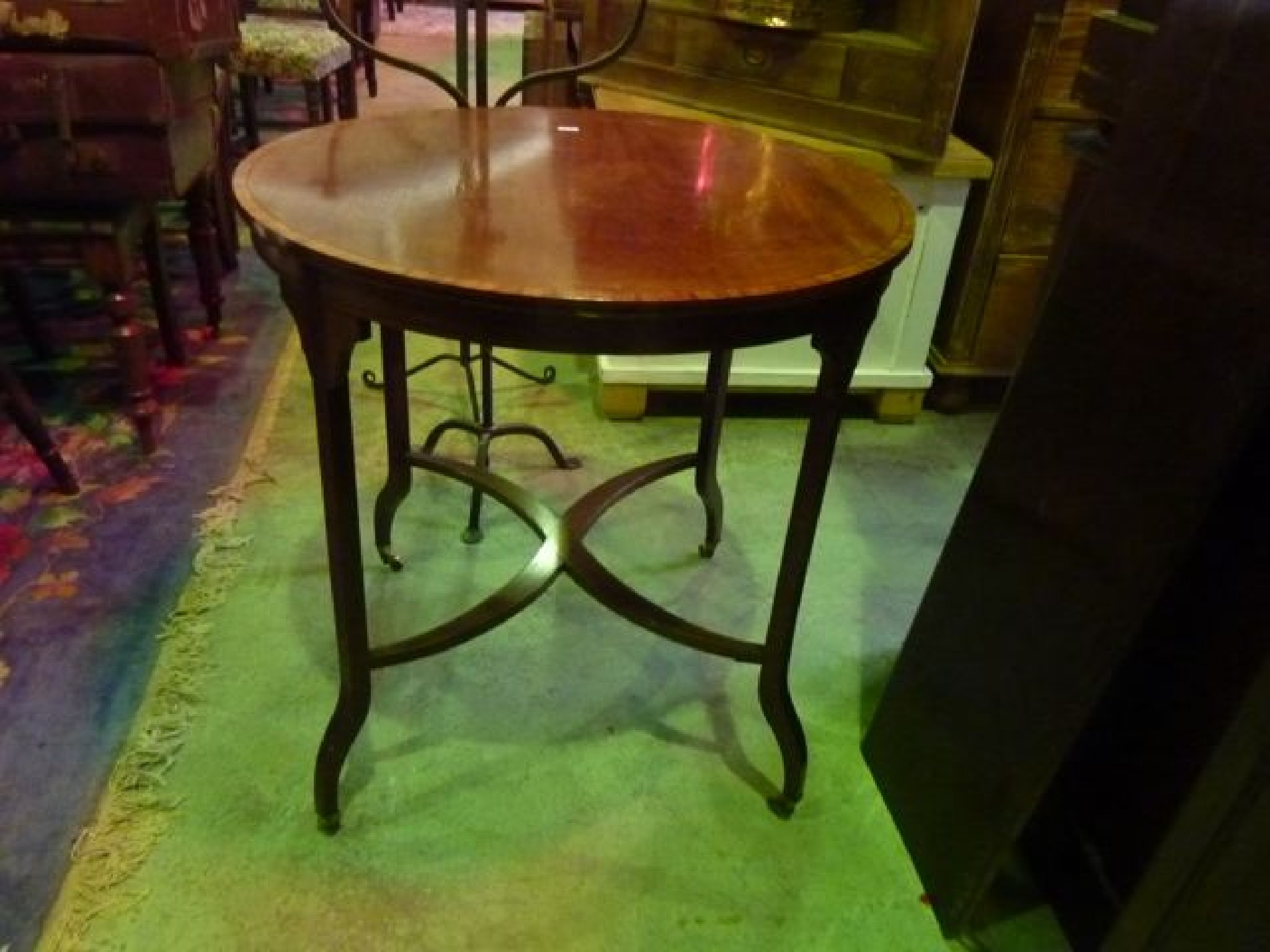 Appraisal: An inlaid Edwardian mahogany occasional table of circular form raised