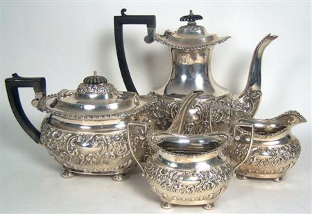 Appraisal: An Edwardian four piece tea and coffee set Nathan Hayes