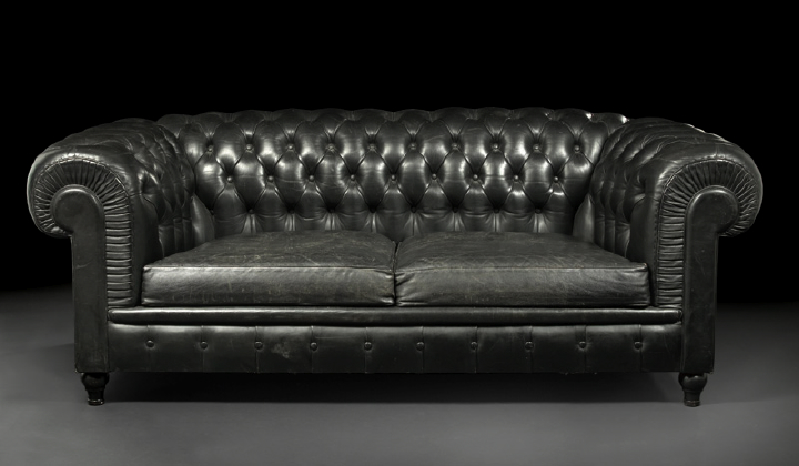 Appraisal: Edwardian Leather-Upholstered Chesterfield Sofa early th century the rounded and