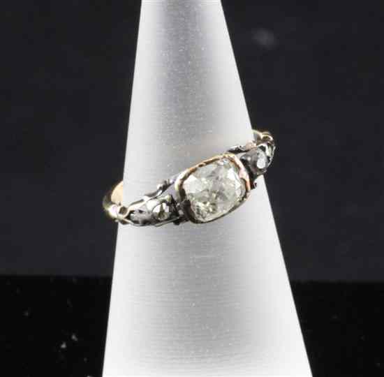 Appraisal: An antique diamond set silver and gold ring with central