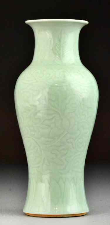 Appraisal: Chinese Qing Celedon Porcelain VaseFinely molded and incised with lotus