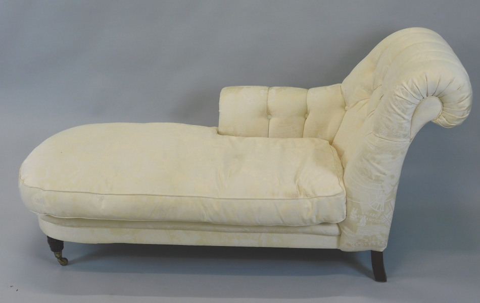 Appraisal: A modern chaise longue upholstered in cream fabric printed with