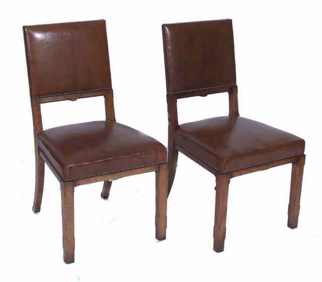 Appraisal: A PAIR OF MODERN OAK SIDE CHAIRS with leather brown