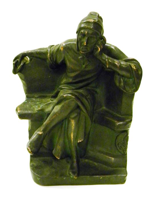 Appraisal: Bronzed sculpture of Renaissance figure in long cap seated on