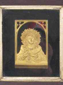 Appraisal: A gilt metal devotional plaque in Victorian rosewood box frame