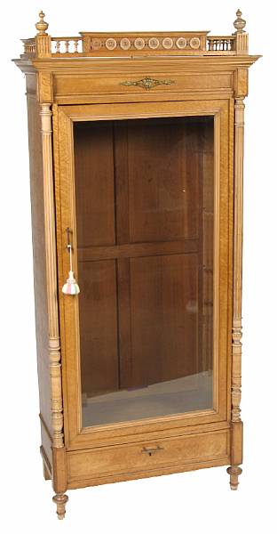 Appraisal: A Renaissance Revival birdseye maple vitrine cabinet with glazed panel