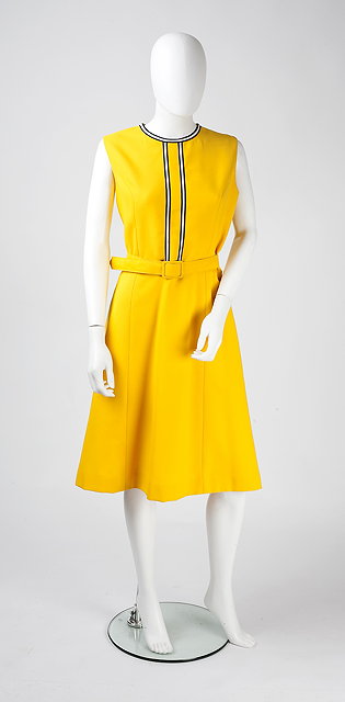 Appraisal: A sleeveless yellow shift dress with belt and A-line skirt