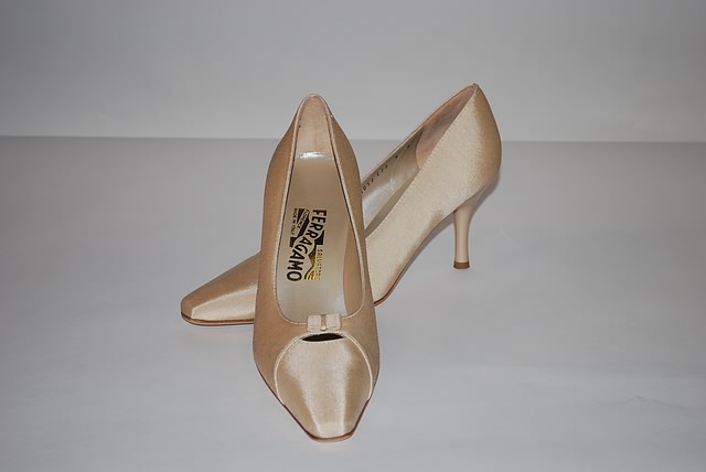 Appraisal: Salvatore Ferragamo off-white fabric pumps Size B Price Original shoe