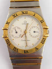 Appraisal: A Gent's Omega Constellation day date wristwatch steel and gold