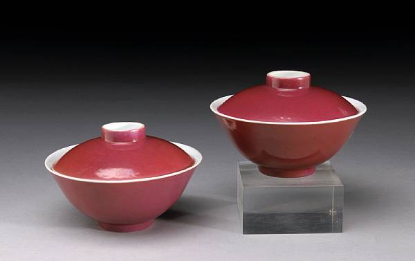 Appraisal: A pair of ruby enameled porcelain covered bowls Daoguang Marks